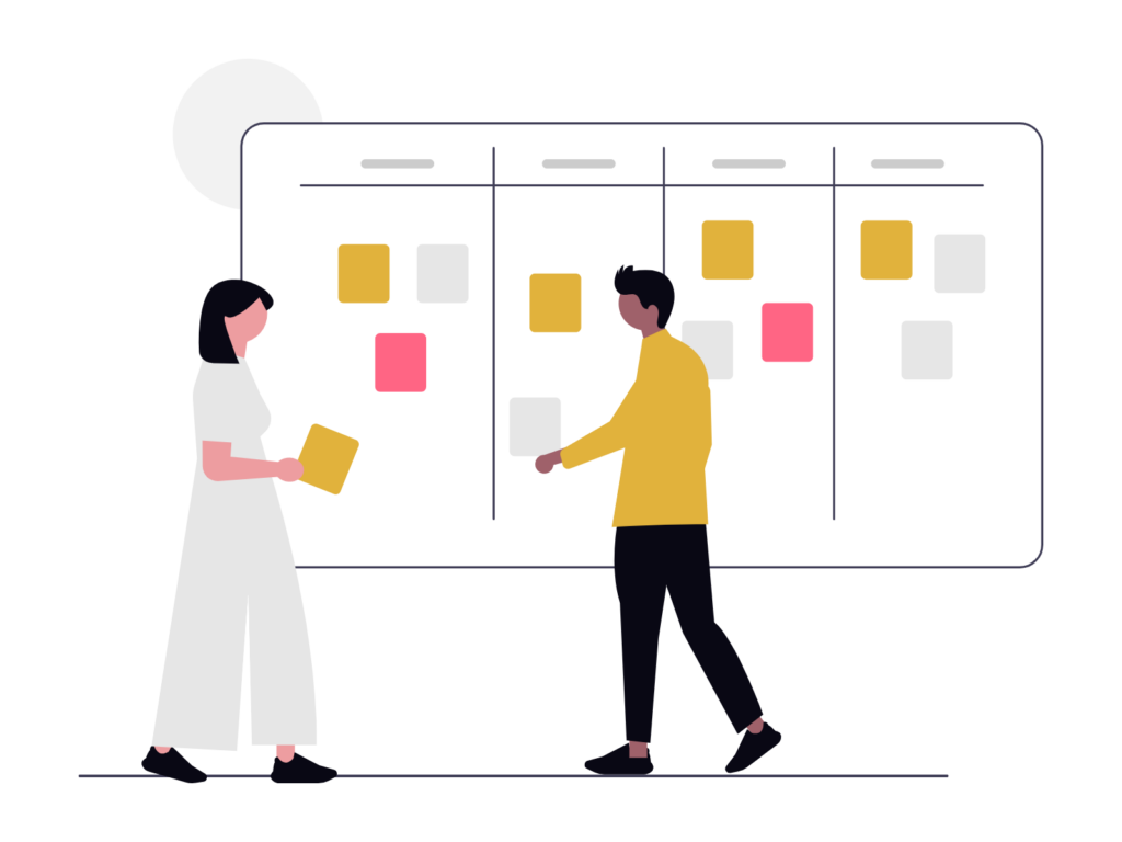 Deux personnes devant un tableau Kanban.